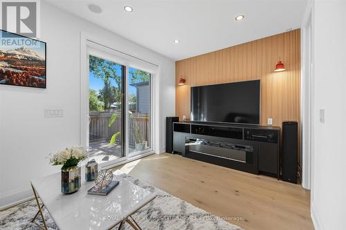 Family Room with Electric Fireplace & W/O to Deck - 396 River Side Drive, Oakville, ON - Indoor