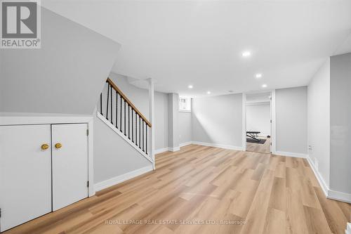 Luxury Vinyl Plank Flooring T/O Finished Basement - 396 River Side Drive, Oakville, ON - Indoor Photo Showing Other Room