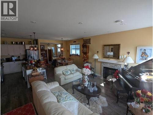 2450 Radio Tower Road Unit# 32, Oliver, BC - Indoor Photo Showing Living Room With Fireplace
