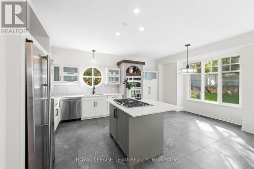 Quartz island features a pop-up vent - 60 Ironside Court, Ottawa, ON - Indoor Photo Showing Kitchen With Upgraded Kitchen
