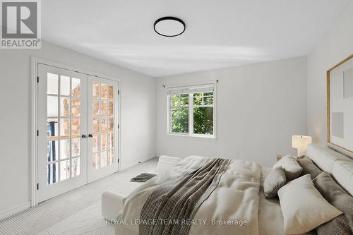Virtually staged bedroom with Juliet balcony - 60 Ironside Court, Ottawa, ON - Indoor Photo Showing Bedroom