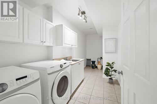 Spacious laundry room with sink and storage - 60 Ironside Court, Ottawa, ON - Indoor Photo Showing Laundry Room