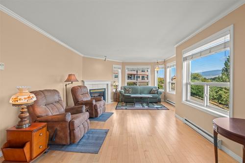 202-3806 35 Avenue, Vernon, BC - Indoor Photo Showing Living Room With Fireplace