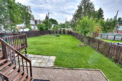 Cour - 15 Rue Ash, Dollard-Des-Ormeaux, QC - Outdoor With Backyard