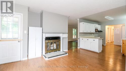 24 Howard Avenue, Tiny, ON - Indoor With Fireplace
