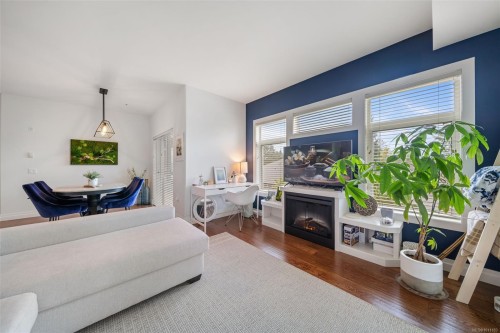 201-2415 Amherst Ave, Sidney, BC - Indoor Photo Showing Living Room With Fireplace