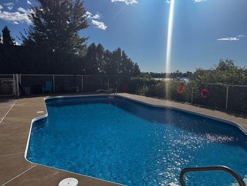Pool - 811-7680 Boul. Marie-Victorin, Brossard, QC - Outdoor With In Ground Pool With Backyard