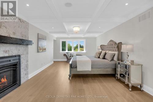 74 Mactaggart Drive, King, ON - Indoor Photo Showing Bedroom With Fireplace