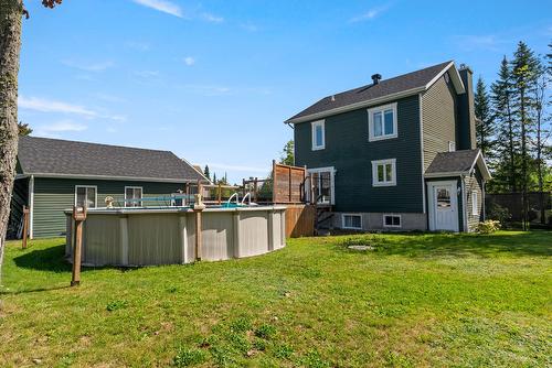 Back facade - 57 Rue Grogan, Shannon, QC - Outdoor With Above Ground Pool