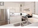 877 Klo Road Unit# 311, Kelowna, BC  - Indoor Photo Showing Kitchen With Stainless Steel Kitchen With Double Sink 