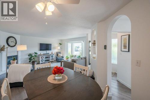 3400 Wilson Street Unit# 106, Penticton, BC - Indoor Photo Showing Dining Room With Fireplace