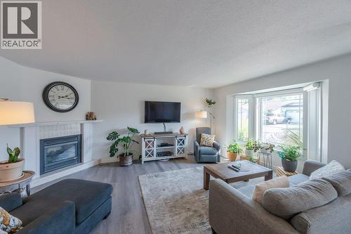 3400 Wilson Street Unit# 106, Penticton, BC - Indoor Photo Showing Living Room With Fireplace