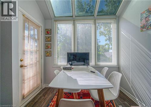 Dining area featuring dark wood-style flooring and vaulted ceiling - 310 Christopher Drive Unit# 15, Cambridge, ON - Indoor Photo Showing Other Room