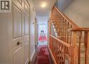 Hallway with a textured ceiling, wood finished floors, and stairs - 310 Christopher Drive Unit# 15, Cambridge, ON  - Indoor Photo Showing Other Room 