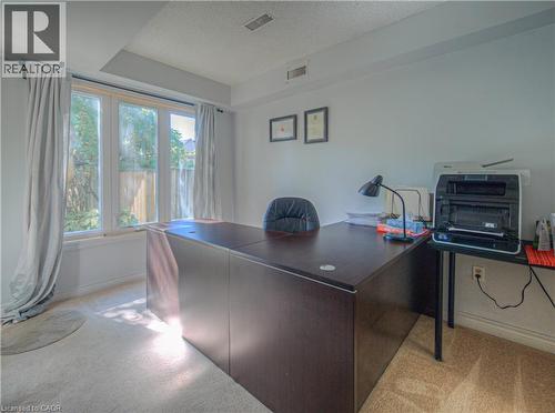Office area with a textured ceiling and light colored carpet - 310 Christopher Drive Unit# 15, Cambridge, ON - Indoor Photo Showing Office
