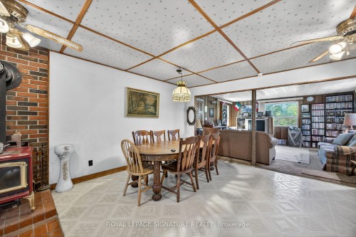 81-77 Bass Bay Drive, Tay, ON - Indoor Photo Showing Dining Room With Fireplace