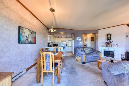 Dining room - 8-4948 Boul. Notre-Dame, Laval (Chomedey), QC - Indoor Photo Showing Living Room With Fireplace