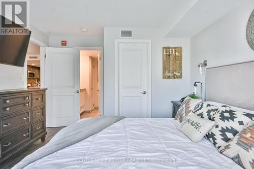 Primary bedroom with walk in closet & ensuite! - 406 - 80 Horseshoe Boulevard, Oro-Medonte, ON - Indoor Photo Showing Bedroom