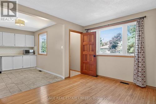 BRIGHT LIVING ROOM AND KITCHEN - 48 Queen Street, Kawartha Lakes, ON - Indoor Photo Showing Kitchen