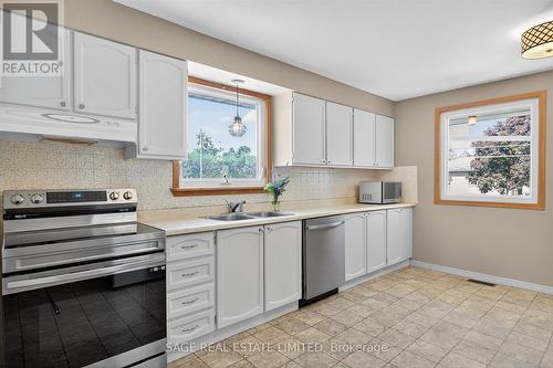 LARGE EAT-IN KITCHEN - 48 Queen Street, Kawartha Lakes, ON - Indoor Photo Showing Kitchen With Double Sink