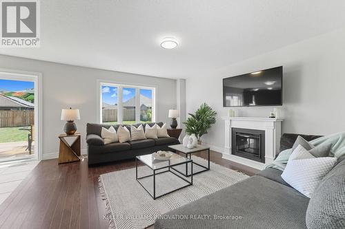 97 Forbes Crescent, North Perth, ON - Indoor Photo Showing Living Room With Fireplace