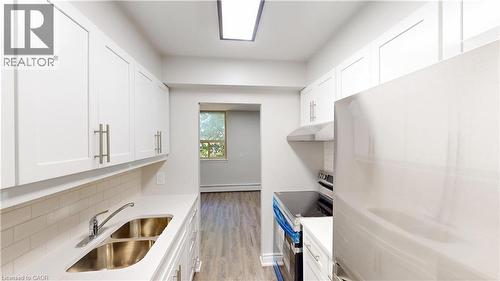 3189 King Street E Unit# 405, Kitchener, ON - Indoor Photo Showing Kitchen With Double Sink
