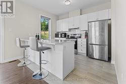 Sunlit kitchen with nature views - 