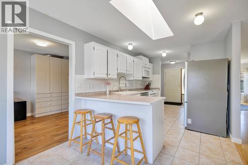 Office/kids room with an entrance from the kitchen - 325 Mctavish Road, Kelowna, BC - Indoor Photo Showing Kitchen