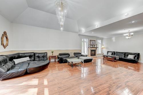 Salle familiale - 136 Rue Jean-De Ronceray, Carignan, QC - Indoor With Fireplace