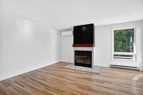 Salon - 898 Boul. Arthur-Sauvé, Saint-Eustache, QC - Indoor Photo Showing Living Room With Fireplace