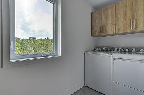 Salle de lavage - Rue Des Rêves, Sainte-Julienne, QC - Indoor Photo Showing Laundry Room