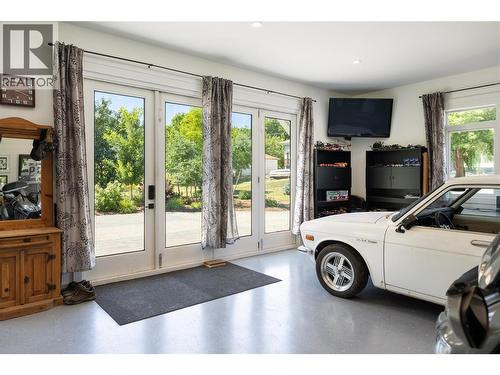 Showroom or Family Room - 6984 Highway 6, Coldstream, BC - Indoor Photo Showing Garage