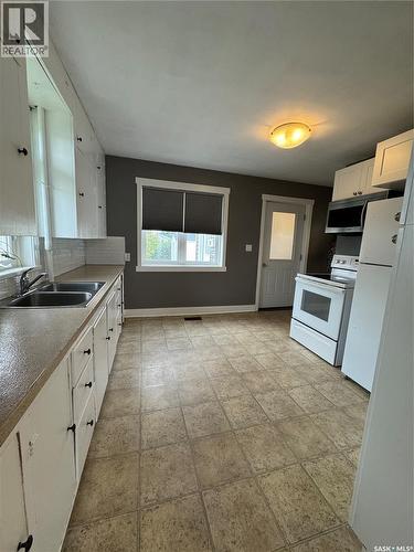 529 Albert Street, Hudson Bay, SK - Indoor Photo Showing Kitchen With Double Sink