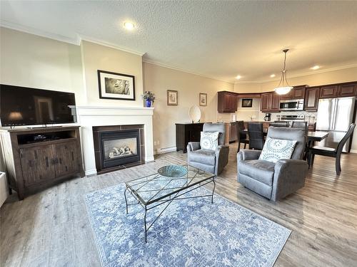 113-100 Bighorn Boulevard, Radium Hot Springs, BC - Indoor Photo Showing Living Room With Fireplace