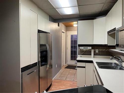 224 Crescent Drive, Swan River, MB - Indoor Photo Showing Kitchen With Double Sink