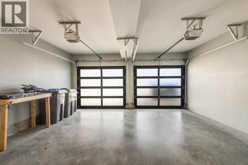 Double Garage with Bay Doors - 1818 Peak Point Court Unit# 12, West Kelowna, BC - Indoor Photo Showing Garage
