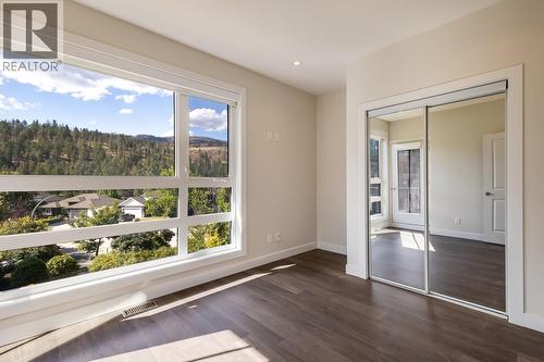 Second bedroom with private patio - 1818 Peak Point Court Unit# 12, West Kelowna, BC - Indoor Photo Showing Other Room
