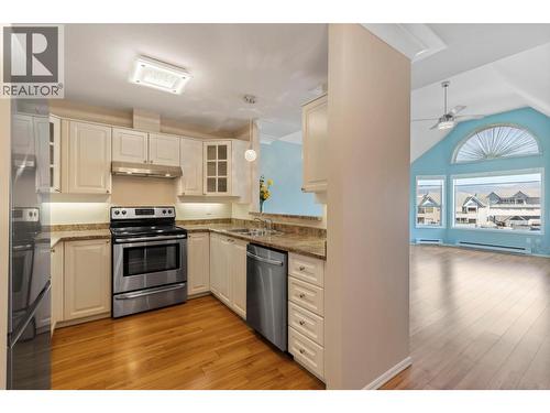 Kitchen with pass through to open Vaulted Dining / Living Rooms - 3283 Casorso Road Unit# 308, Kelowna, BC - Indoor Photo Showing Kitchen