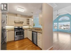 Kitchen with pass through to open Vaulted Dining / Living Rooms - 