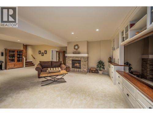 4157 Gallaghers Parkland Drive, Kelowna, BC - Indoor Photo Showing Other Room With Fireplace