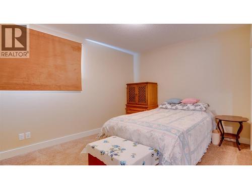 Lower Level Bedroom - 567 Mt Ida Drive, Coldstream, BC - Indoor Photo Showing Bedroom
