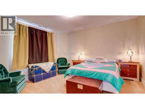 Lower Level Bedroom - 567 Mt Ida Drive, Coldstream, BC - Indoor Photo Showing Bedroom