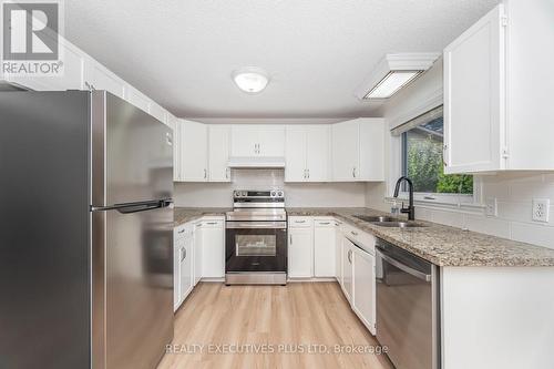 3 Hickory Court, New Tecumseth, ON - Indoor Photo Showing Kitchen With Double Sink