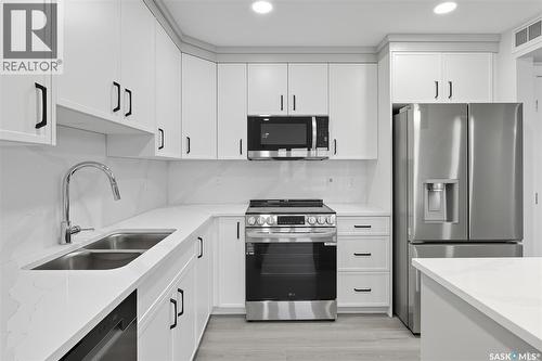208 318 108Th Street W, Saskatoon, SK - Indoor Photo Showing Kitchen With Stainless Steel Kitchen With Double Sink