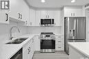 208 318 108Th Street W, Saskatoon, SK  - Indoor Photo Showing Kitchen With Stainless Steel Kitchen With Double Sink 