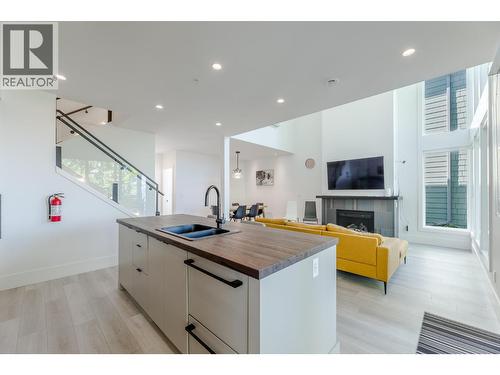 3240 Landry Crescent, Summerland, BC - Indoor Photo Showing Kitchen With Fireplace With Double Sink