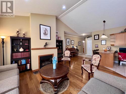 Living Room - 11 - 500 Lakeview Drive, Woodstock (Woodstock - North), ON - Indoor Photo Showing Living Room With Fireplace