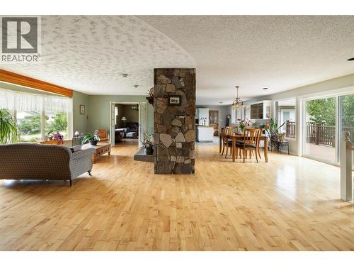 Beautiful hard wood flooring - 10108 Venables Drive, Coldstream, BC - Indoor Photo Showing Other Room