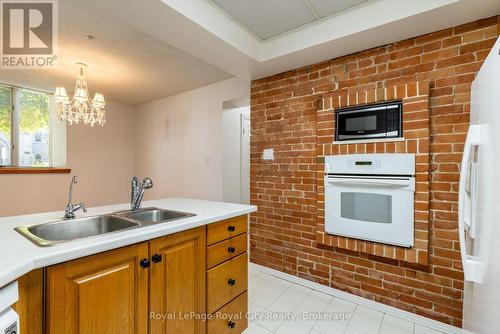 101 - 57 Suffolk Street W, Guelph (Downtown), ON - Indoor Photo Showing Kitchen With Double Sink