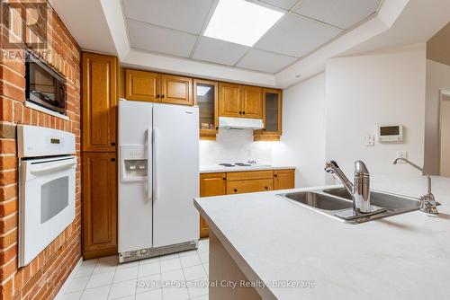 101 - 57 Suffolk Street W, Guelph (Downtown), ON - Indoor Photo Showing Kitchen With Double Sink